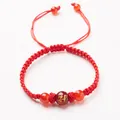 Red braided rope bracelet with a gold dragon motif bead and adjustable pull closure - Zodiac Dragon