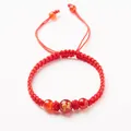 Handmade red cord bracelet featuring a gold dragon engraved natural agate bead - Zodiac Horse