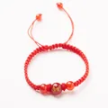 Handmade red braided cord bracelet with natural agate bead featuring a golden goat zodiac - Zodiac Sheep