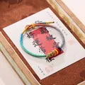Handcrafted Chinese braided silk bracelet in vibrant colors with auspicious charms - Handwoven Seven Wisdoms Cord Bracelet