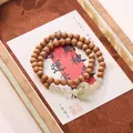 Brown wooden beaded double-layer bracelet with green jade peace buckle charm accessory - Sandalwood and Hetian Jade Runner Bracelet