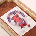 Handmade beaded bracelet with multi-color crystals and purple flower charm pendant - Amethyst Nine Purple Flame Bracelet
