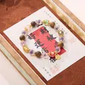 Buddhist prayer bead bracelet with dark wood, purple beads and gold Fu pendant - Agarwood and Glass Bead Bracelet