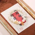 White Bodhi seed bracelet with a pink enamel flower charm and cute pet bead accessory - Lucky Cat Flower Beaded Bracelet
