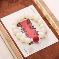 Traditional 18 beads bracelet featuring milky white beads and a red carved center bead - 12mm White Bodhi Cinnabar Pixiu Bracelet