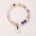 Detail of 8mm natural jade beads bracelet with gold crown charm and translucent donut pendant - Crown With Chalcedony Pingan Buckle Style