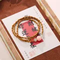 Bamboo shaped double wrap Buddhist bead bracelet with pink carved floral charm - Triple Strand Lotus Green Aventurine Bracelet