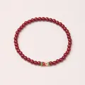 Deep red tiger eye beaded bracelet with gold-edged fish scale enamel cylinder charm - 4mm / Cinnabar Koi Style