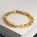 6mm tiger eye beaded bracelet with a golden fish charm on a minimalist white background - 6mm / Golden Tiger Eye Koi Style
