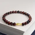 Red tiger eye bead bracelet with a matte gold fish charm for women - 6mm / Red Tiger Eye Koi Style