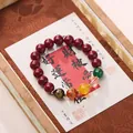 Traditional cinnabar red beaded bracelet with colorful accent beads on silk tray - 10mm Cinnabar Fortune God Bracelet