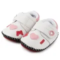 Detailed macro view of infant baby shoes with heart patches and non-slip red rubber sole - 12cm / Heart White