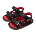 Detailed view of baby sandals with black leather, red lining, and double hook-and-loop straps - Zero To Six Months Stage / Black