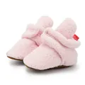 Close-up of pink fleece baby boots featuring a brown non-slip sole and Velcro closure - 13cm / Pink