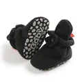 Detail of baby walking shoes with anti-slip dotted sole and secure side metal fastener - 11cm (0-6 Months) / Black