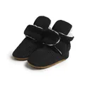 Detailed view of baby walking shoes with black corduroy fabric and warm white plush lining - 11cm (0-6 Months) / Black