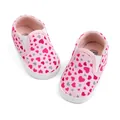 Pink canvas baby shoes with heart patterns and soft soles in a slip-on style - 0-6 Months / Heart Pink