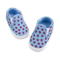 Detail view of baby canvas slip-on shoes with red strawberry patterns on light blue fabric - 0-6 Months / Strawberry Blue