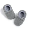 Close-up of grey ribbed baby shoe insole showing age 0-6 months and size EUR 18 - 12cm (6-12Months) / Gray