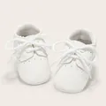 White soft-soled baby walking shoes with classic brogue details and lace-up design - 11cm (0-6 Months) / White