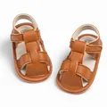 Detailed top view of brown leather baby sandals with soft soles and T-strap velcro closure - 11cm / Brown
