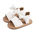 White faux leather baby girl sandals with large bow accent and non-slip brown insoles - White (CG5257)