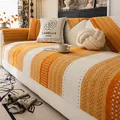 Copridivano in ciniglia arancione e beige con trama antiscivolo e cuscino floreale - 70x70cm / Arancione