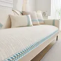 Beige chenille bankovertrek met gewatteerde strepen en een blauwgroene bladrand - 70*70cm / crème