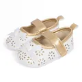 Detail of baby princess shoe with floral laser-cut patterns and white fabric bow - 0-6 Months / White