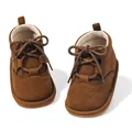 Detailed close-up of brown PU leather baby boots with elegant brogue wingtip punch details - 11cm (0-6 Months) / Brown