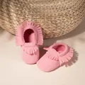 Detail of pink suede baby boots with decorative tassels and elastic soft sole for infants - 11cm / New Pink