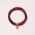 Triple-wrap garnet bead bracelet with green jade bead and golden Fu tag charm - Qingshui Hetian Jade & Fu Tag Style / 3mm Bead Diameter / Triple-Wrap / Burgundy