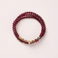 Three-layer 4mm garnet bead bracelet with multicolor crystal accents and golden charms - Multicolor Tourmaline Accents Style / 4mm Bead Diameter / Triple-Wrap / Burgundy