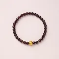 Three-layer garnet beaded bracelet featuring a gold textured charm and spacer beads - Gold-Plated Copper Five Scriptures Style / 5mm Bead Diameter / Single-Wrap / Burgundy