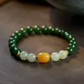 Detail of vintage jasper bracelet with amber beads and ornate gold metal spacers - 8mm Green Jade Amber Date Bead 925 Silver Gold Plated Bracelet