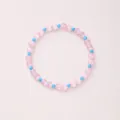 Pink cat eye stone beaded bracelet with light blue faceted beads on a soft pink background - Pink Cat's Eye Faux Turquoise Faceted (6mm)
