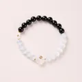 Black and white cat eye stone bead bracelet with a transparent cat paw charm pendant - Black Agate Cat's Eye Coin Cat Paw