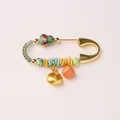 Detail of a Chinese gold horse year safety pin brooch with enamel gourd and fuzhou lock - Enamel Gourd Fortune Lock Persimmon Brooch