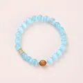 Minimalist cat eye bead bracelet in light blue with gold spacers and wood bead - Blue Cat's Eye Sandalwood Green Aventurine (8mm)