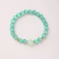 Elegant mint green cat eye stone beaded bracelet with golden hollow floral spacers - Mint Green Cat's Eye Prehnite Chalcedony (8mm)