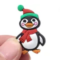 Cute Christmas penguin PVC shoe charm accessory shown held by hand for size reference - Cartoon Penguin Accessory