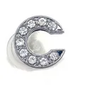 Close-up of letter C shoe charm with inlaid white zircons and silver alloy finish - Letter C