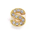 Macro shot of gold letter S shoe charm featuring sparkling pave-set crystal stones - Letter S