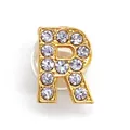 Close-up of golden alloy letter R shoe charm with sparkling rhinestones and rubber backer - Letter R