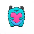 Teal monster shoe charm holding a pink heart for clogs and DIY accessories - Blue Monster Holding Heart (1)