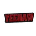 Detailed view of red YEEHAW embossed PVC shoe charm for garden clogs and sandals - Red YEEHAW