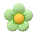 Close-up of a resin flower charm in green and yellow for garden clog decoration - Green