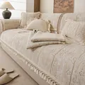 Copridivano jacquard bianco crema con motivo prugna e bordi con nappe in un ambiente caldo - 70cmx70cm / Marrone