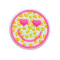 Macro shot of a cute round PVC shoe charm with pink heart eyes and a smiley face - Heart Eyes Smile Face (F172-12)