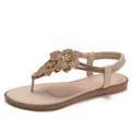 Flat beige beach sandals with rhinestone flower details and elastic back strap - EU 36 / Apricot